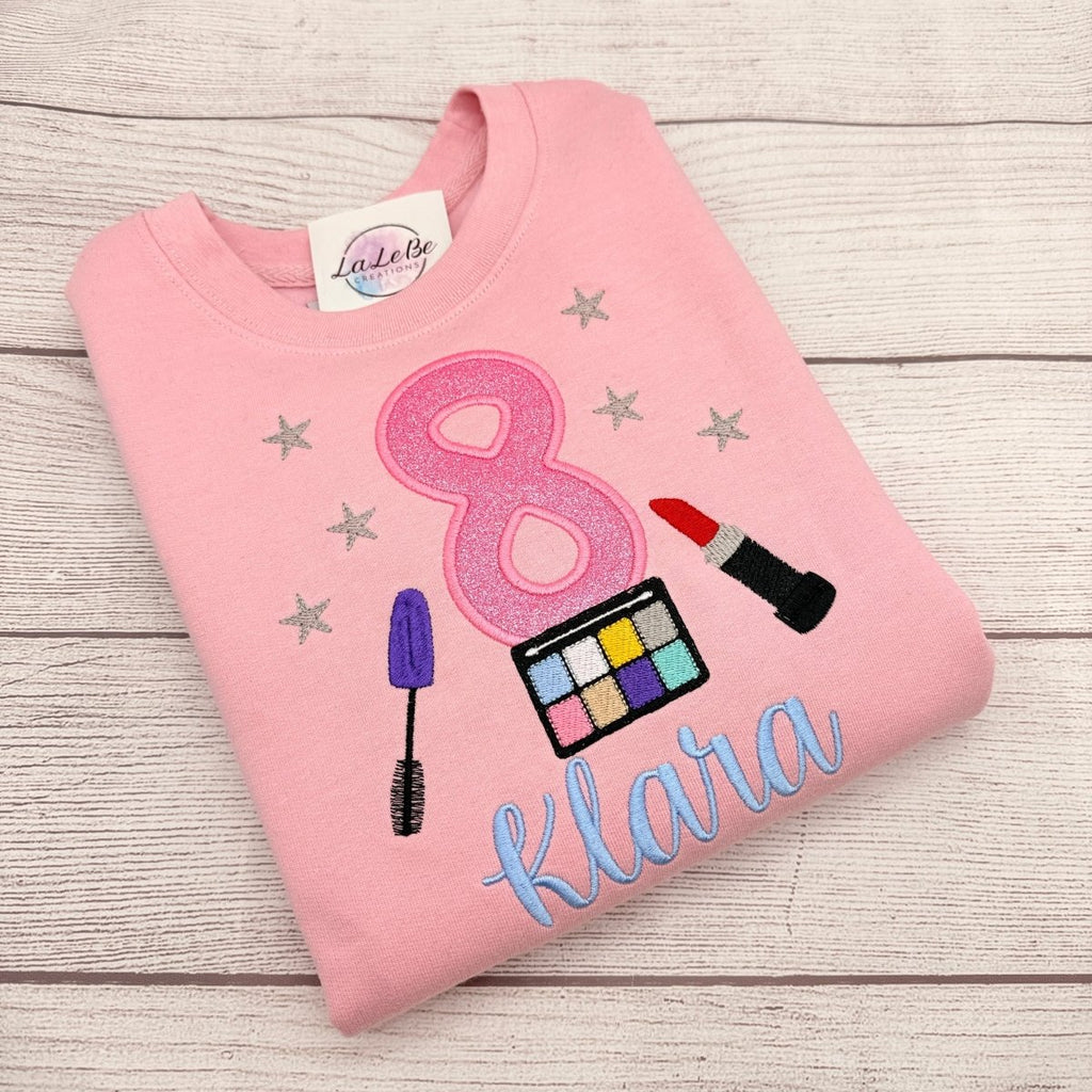 Make-up Geburtstagsshirt Mädchen personalisiert mit Glitzerzahl und bestickten Schmink-Motiven – LaLeBe Creations