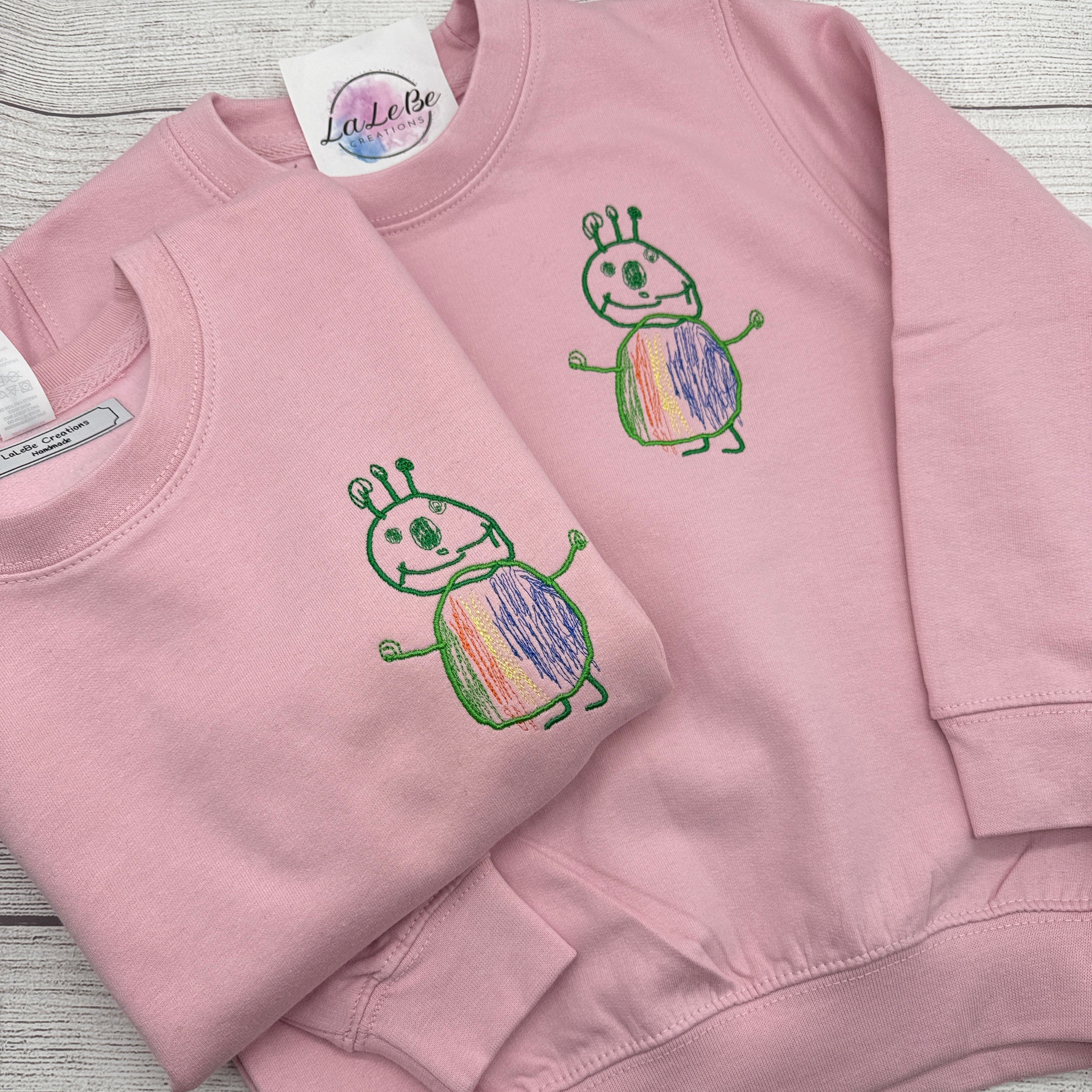 Besticktes Sweatshirt mit Kinderzeichnung - Rosa